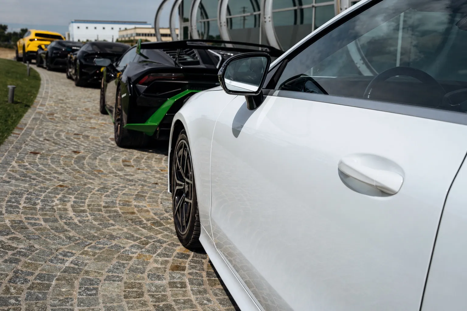 White sports car on the Tuscan driveway